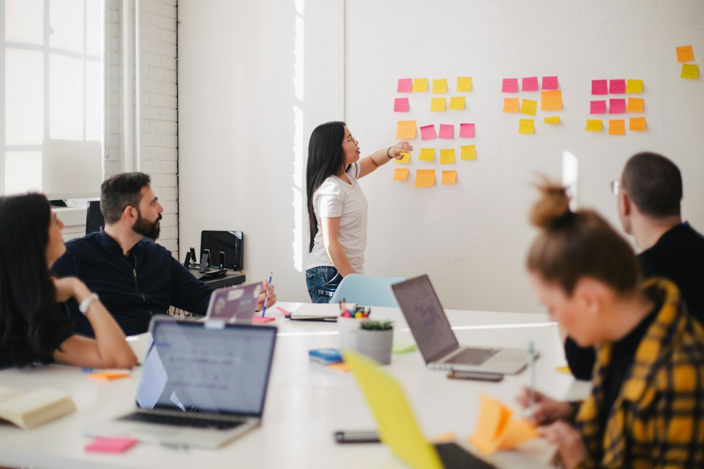 People identifying customer journey challenges together